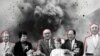 Тодор Живков (в средата) и други партийни и държавни ръководители от 80-те години на фона на взрив. Колаж.
