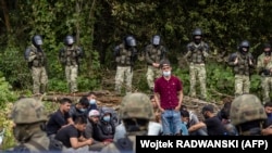 Izbeglice i migranti na granici Poljske i Belorusije, u blizini poljskog sela Bialistok, na severoistoku zemlje, avgust 2021.