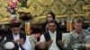 Afghan President Hamid Karzai (left) prays at a meeting with tribal leaders in Kandahar city on June 13. "I want your cooperation in this operation," he said.
