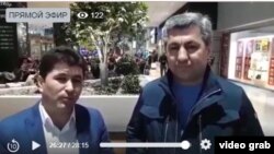 Sharofiddin Gadoev (left) with Muhiddin Kabiri, the exiled leader of the banned Islamic Party of Tajikistan, in a video purportedly shot at Frankfurt Airport on March 2.