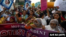 Activists march during a protest against the alleged gang rape of a woman in Lahore on September 12.