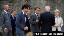 Presidentja e KE-së, Ursula von der Leyen, Presidenti i SHBA-së, Joe Biden, Presidenti francez, Emmanuel Macron, Kryeministri italian, Mario Draghi, ai i Kanadasë, Justin Trudeau, i Japonisë Yoshihide Suga dhe Presidenti i Këshillit Evropian, Charles Michel. 