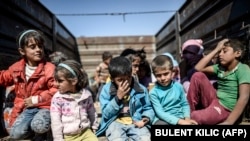 Syrian refugees on the Syrian-Turkish border near Suruc.