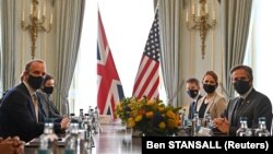 U.K. Foreign Secretary Dominic Raab (left) and U.S. Secretary of State Antony Blinken pose for a photo ahead of their bilateral meeting in London on May 3. 