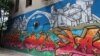Bosnia and Herzegovina -- A mural in Bosnian city of Mostar (art, wall, walls, society, idea, ideas, creativity, building, buildings, beautiful, urban, young people, artists), June 16, 2021.