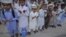 Pakistan -- Students of a madrasa (religious school) pray before going into a classroom at Karachi's Memon Mosque, 24Jun2012