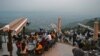 People flock to a restaurant on Margalla Hills in Islamabad on August 10 after the government announced it would be lifting most of the country's remaining coronavirus restrictions.