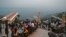 People flock to a restaurant on Margalla Hills in Islamabad on August 10 after the government announced it would be lifting most of the country's remaining coronavirus restrictions.