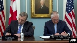 რექს ტილერსონი და გიორგი კვირიკაშვილი