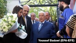 Глава МИД Сирии (в центре)