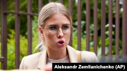 Lyubov Sobol speaks to the media as she arrives for a court hearing in Moscow on August 3.