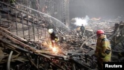 Emergency workers carry out search and rescue operations at the Crocus City Hall concert venue outside Moscow on March 24. 