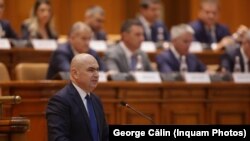 Prezentarea programului de guvernare în plenul reunit înaintea votului pentru învestirea guvernului condus de prim-ministrul desemnat Ilie Bolojan, la Palatul Parlamentului din București, 23 iunie 2025. 