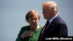 Njemačka kancelarka Angela Merkel i američki predsjednik Donald Trump na samitu G7 u kanadskom Kvebeku 8. juna.