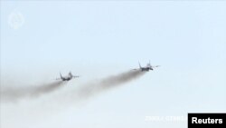 Două avioane de luptă MiG-29 donate Ucrainei de Slovacia, în schimbul unui armament modern oferit de Statele Unite. Baza aeriană Silac, Slovacia, 23 martie 2023