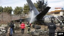 На месте крушения самолета в аэропорту Паям, Иран, 14 января 2019 года. 