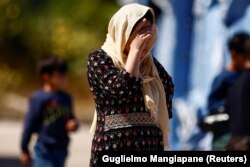 ავღანელი ლტოლვილი ქალი. ავეზანო, იტალია, 30 აგვისტო.