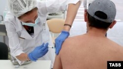 A man receives an injection of the Sputnik-Light single-dose vaccine in Moscow on June 30.