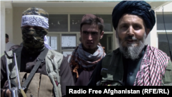 Mullah Abdul Fatah Sadiq (R) is the Taliban commander responsible for education in Mohammad Agha.