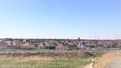 Отремонтированные дома в центральной части Арыси.