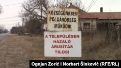 Tabla na kojoj piše "Našu opštinu čuva civilna straža"