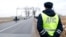 RUSSIA -- Migrant workers from Kyrgyzstan harvest potatoes in a private field in the Beryozovsky district of Krasnoyarsk region, September 8, 2017A traffic police officer at a regional weigh station near the village of Rodniki, January 24, 2017