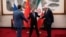 Kineski ministar vanjskih poslova Wang Yi (u sredini) pozdravlja zamjenika ruskog ministra vanjskih poslova Sergeja Ryabkova (desno) i zamjenika iranskog ministra vanjskih poslova Kazema Gharibabadija prije sastanka u Pekingu u martu o iranskom nuklearnom programu.