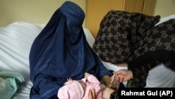 A child receives a measles vaccine at the Indira Gandhi Children's Hospital in Kabul.
