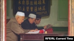 Ethnic Kazakhs pray in a mosque in the Chinese Xinjiang Uyghur Autonomous Region.