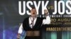 SAUDI ARABIA – Ukraine's Oleksandr Usyk, left, gestures after his joint press conference with and Britain's Anthony Joshua in Jeddah, Saudi Arabia, Aug. 17, 2022