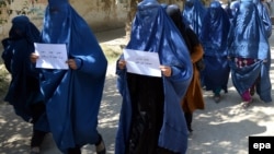 FILE: Afghan women protest against a rape case in the capital Kabul in 2014.