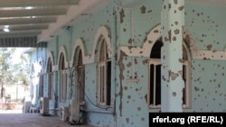 Bullet holes are seen on the wall of a mosque at an A mosque inside the Afghan military base where Taliban assailants killed scores of soldiers on April 21.
