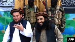 FILE: Tehreek-e Taliban Pakistan (TTP) spokesman Ehsanullah Ehsan (L) and with new TTP leader Adnan Rasheed in February 2013