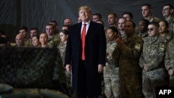 US President Donald Trump speaks to the troops during a surprise Thanksgiving day visit at Bagram airbase in 2019. 
