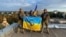 UKRAINE – Ukrainian military personnel on the roof of a building in the city of Kupyansk, Kharkiv Oblast, liberated from the army of Russia. The photo was published on September 10, 2022 