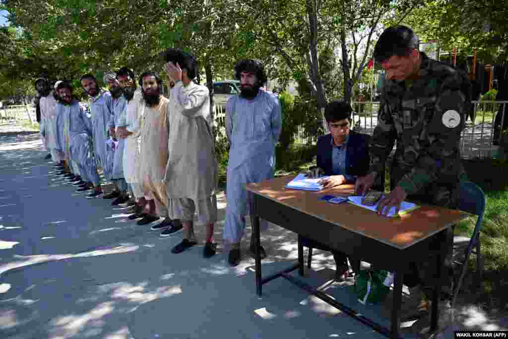 Afghan National Army soldiers register Taliban prisoners during their release from Bagram prison, located about 50 kilometers north of Kabul.&nbsp;A spokesman for Afghanistan&#39;s national-security adviser said that the former Taliban fighters had promised not to return to the battlefield.