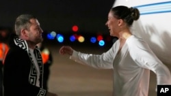 US-Russian dual national Ksenia Karelina greets her fiancé, professional boxer Chris van Heerden, as she arrives Thursday, April 10, 2025, at Joint Base Andrews, Md.