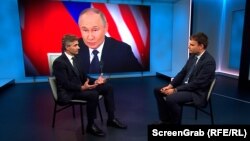 Министр иностранных дел Литвы Кястутис Будрис (слева) во время интервью с корреспондентом РСЕ/РС Рикардом Йозвяком в Праге