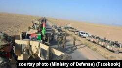 An Afghan army exercise in a rural district of Kandahar on August 17.
