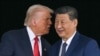US President Donald Trump (L) talks to China's President Xi Jinping as they shake hands after their talks at the Gimhae Air Base, located next to the Gimhae International Airport in Busan on October 30, 2025.