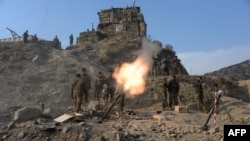 FILE: Afghan National Army soldiers fire a 120mm mortar round during an ongoing anti-Taliban operation in Dangam district near the Pakistan-Afghanistan border in the eastern Kunar Province.