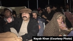 Arman Luni's elderly mother (R) and lawmaker and senior PTM leader Ali Wazir at his funeral late on February 3.