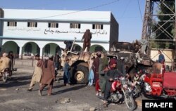 Taliban fighters taking control of Lashkar Gah in August.