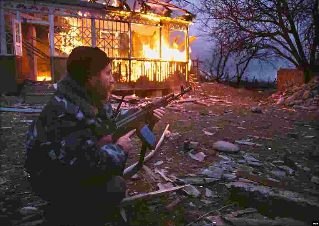 A Russian serviceman during the battle of Komsomolskoye, a village where more than 700 people, many of them civilians, were killed in March 2000. Later that spring Putin, elected president in March and inaugurated in May, imposed direct Kremlin rule over Chechnya.