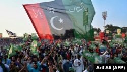 Activists of the Pakistan Democratic Movement rally in the eastern city of Gujranwala on October 16.