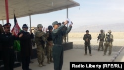 FILE: A police graduation ceremony in Tarinkot, Afghanistan.