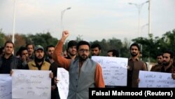 PTM supporters chant slogans against the murder of senior police officer Tahir Dawar, whose body was found in Afghanistan after he disappeared from Islamabad in October 2018.