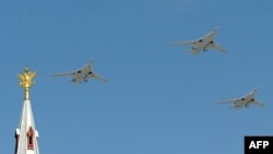 Russian Tu-22 M3 bombers fly over Red Square during a Victory Day parade in Moscow.
