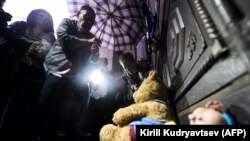 People place stuffed toys in front of the Russian Supreme Court during a rally to demand the release of two teenagers accused of "extremism" in a case they say is part of a growing Kremlin crackdown on Russian youth, in Moscow on August 15.