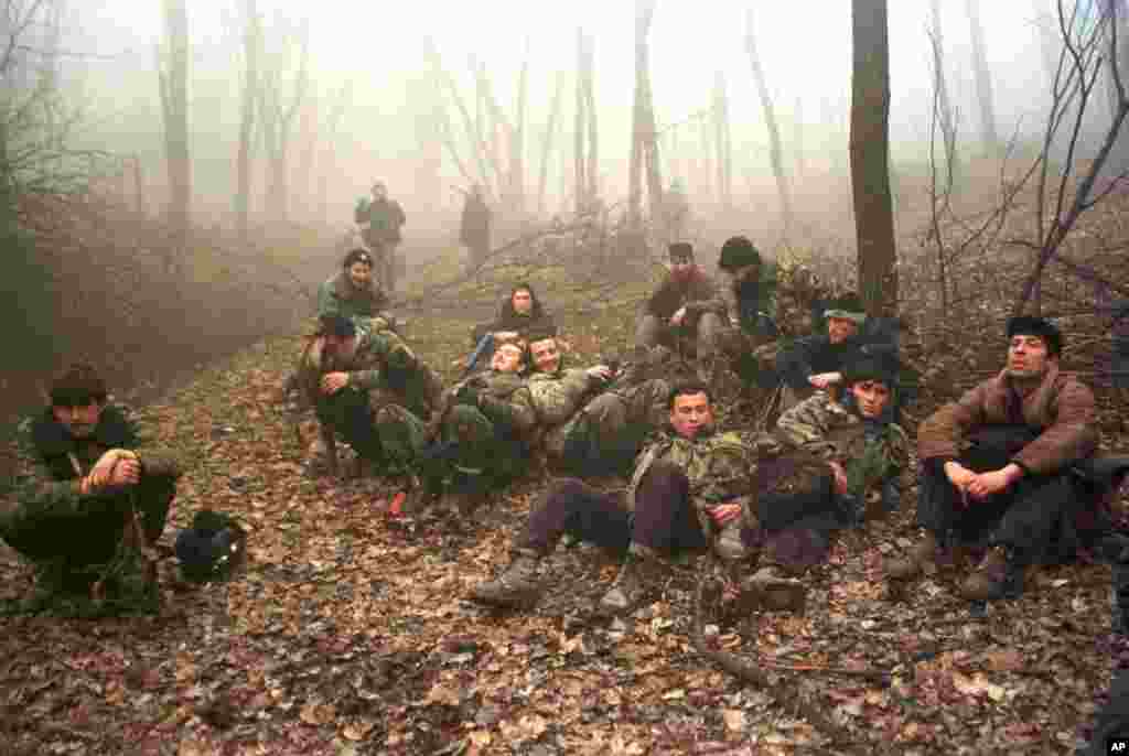 Chechen fighters resting in a forest near Grozny in December 1999.